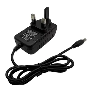 Factory in China 9V 1A 9W UK Plug AC DC Power Adapter with 1 Meter Cable PC Material for LED Lighting and Electronic Devices